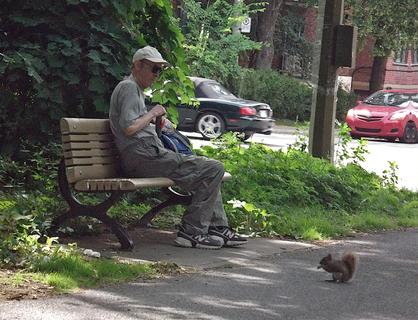 Man Feeding a Squirrel