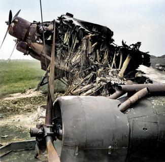 061 - Found description 'A wrecked French aeroplane at Le Bourget, near Paris, after the airfield had been bombed'